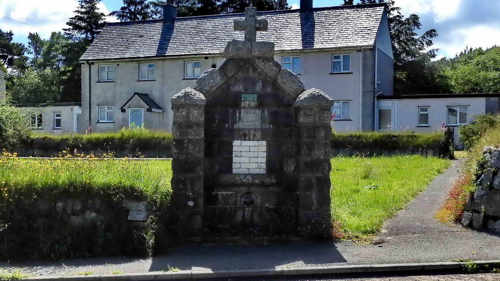 One of two 1908 now-defunct drinking fountains. This one is beside Two Bridges Road in front of Oakery Crescent and the other is beside the Prince of Wales public house on the road to the prison