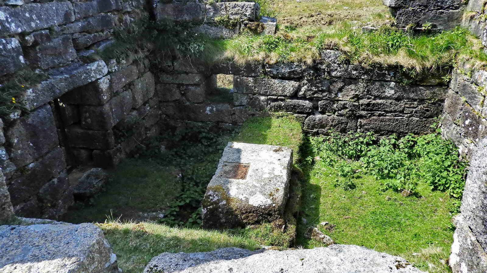 Depression in a granite block to house the axle of the waterwheel - there is a mirror-image stone in the other half of the “wheelhouse”